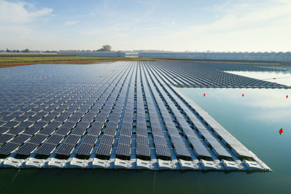 Floating solar panels arranged on water surface for sustainable renewable energy production