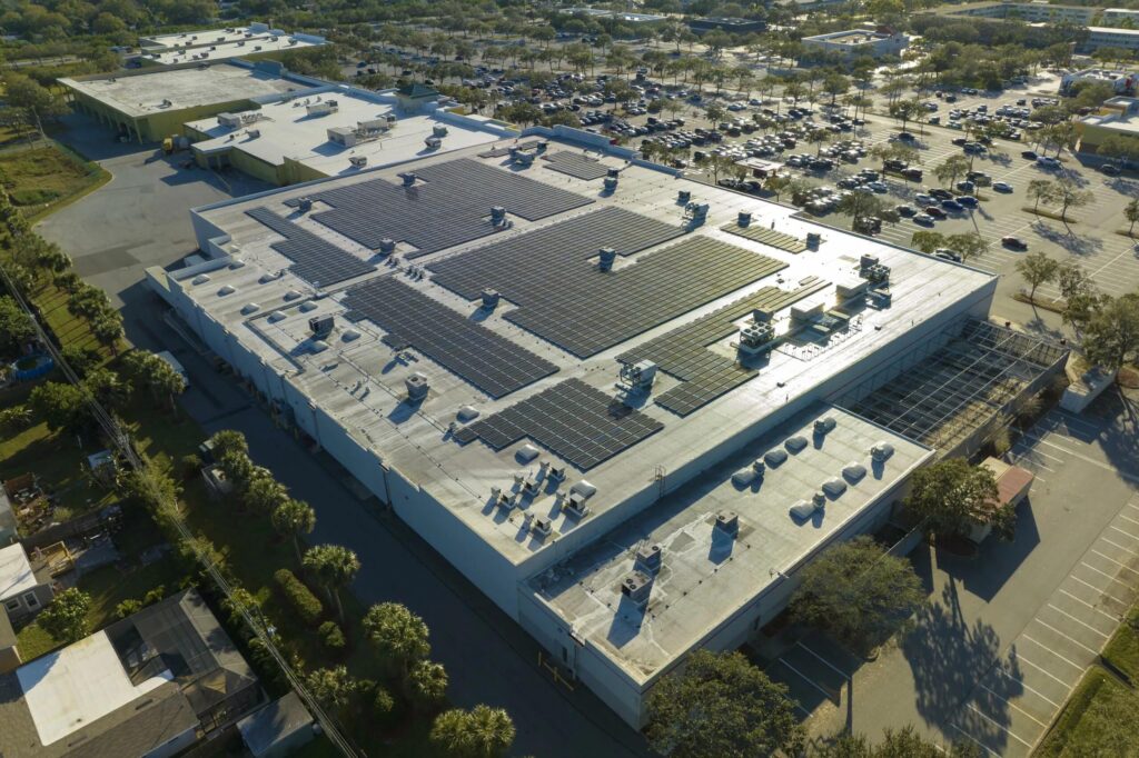 Different rooftop types including flat RCC and tilted metal roofs influencing solar panel installation design and performance