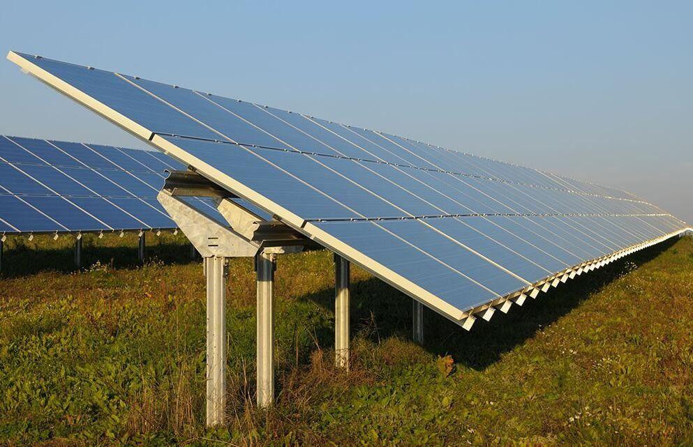 Comparison of ground mount and rooftop solar systems showing panels installed on open land and building rooftops