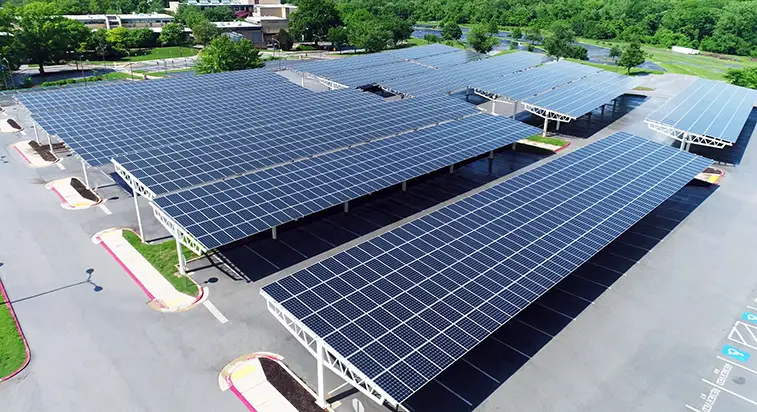 Solar carport structures installed over parking spaces for clean power generation