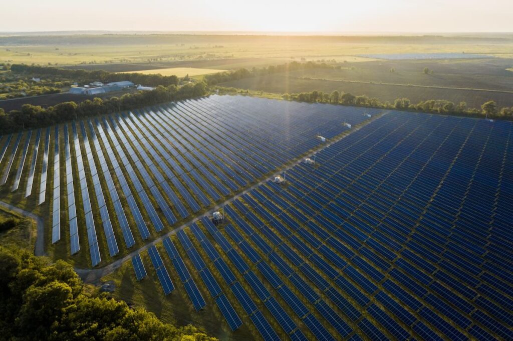 Aerial view of a large ground mounted solar power plant installed across open land