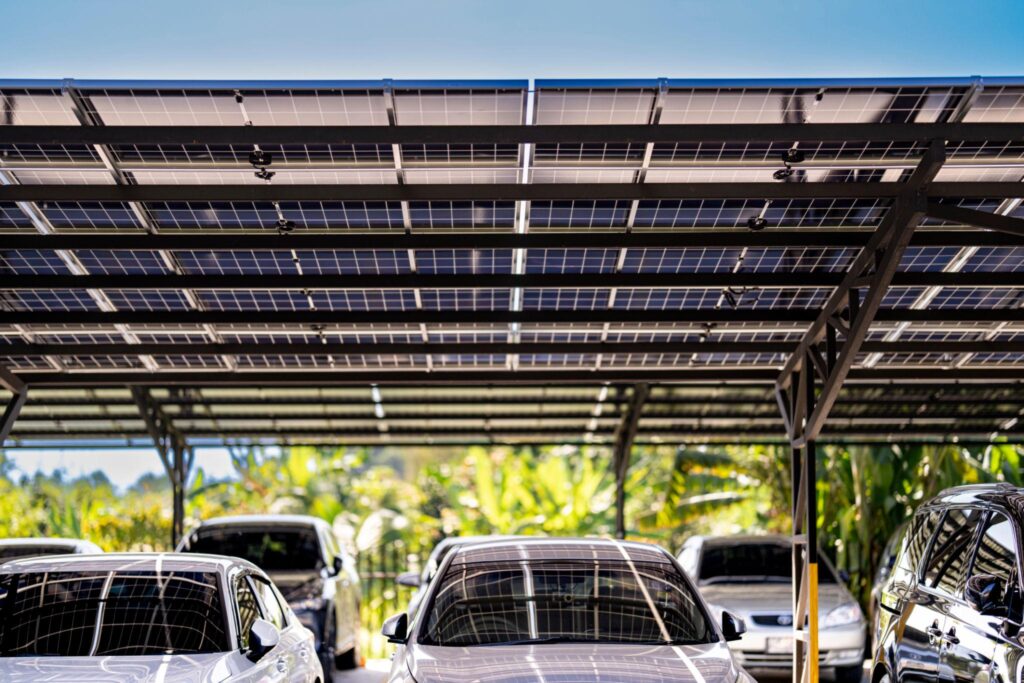 Solar carport installation planning showing site assessment, structural design, and regulatory compliance for commercial projects