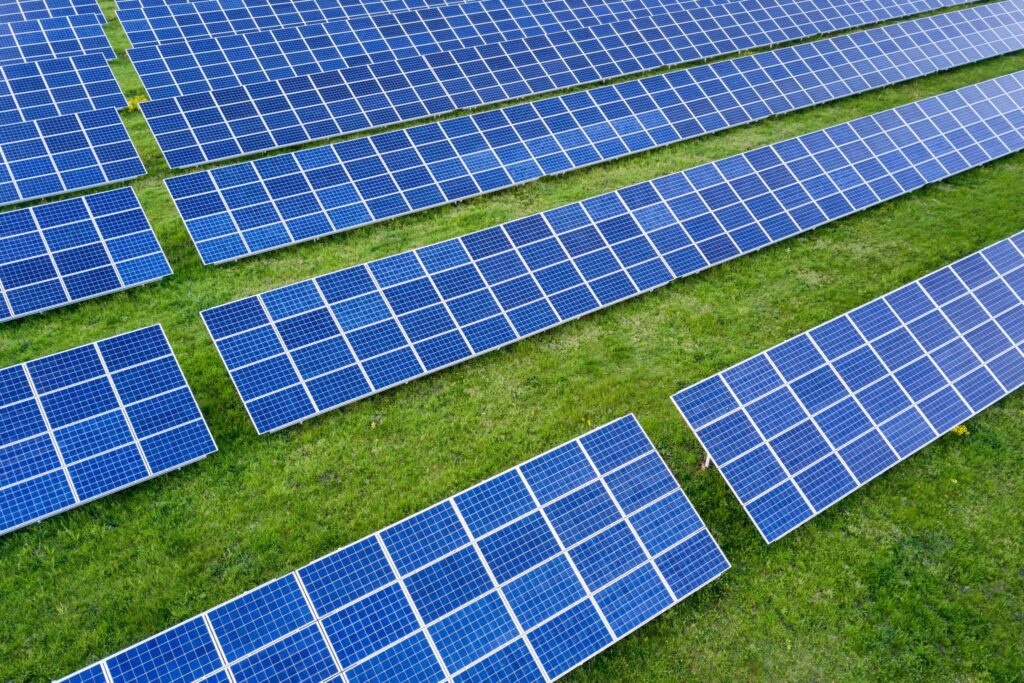 Ground mounted solar system with sustainable land management, vegetation growth, and eco-friendly environmental design