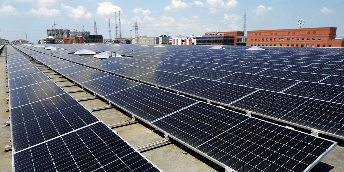 Large rooftop solar panel system installed on an industrial facility