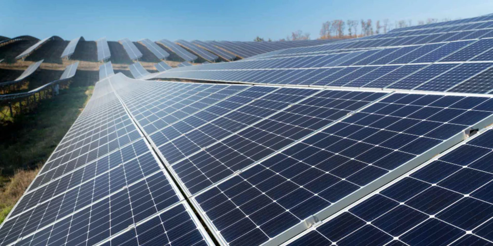 Rows of ground mounted solar panels installed for commercial power use