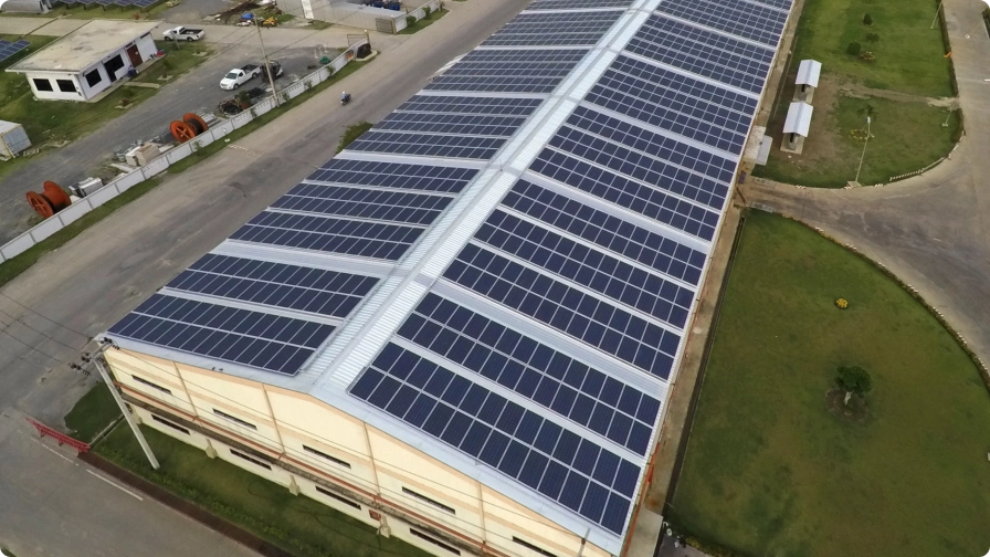 Rooftop solar panels installed on a large industrial building