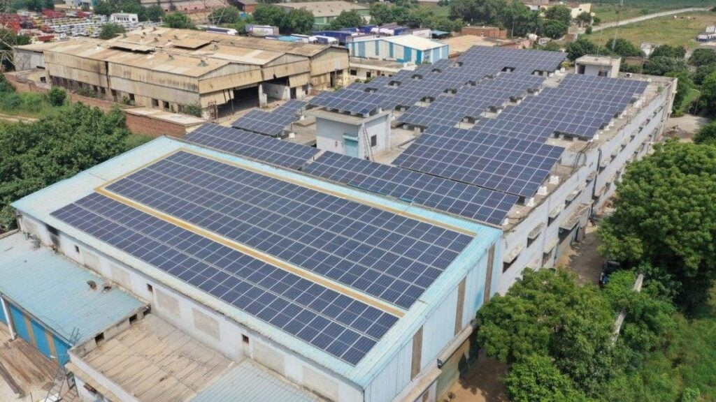 Types of industrial solar systems including grid-tied, hybrid with battery backup, and off-grid solutions for different business needs